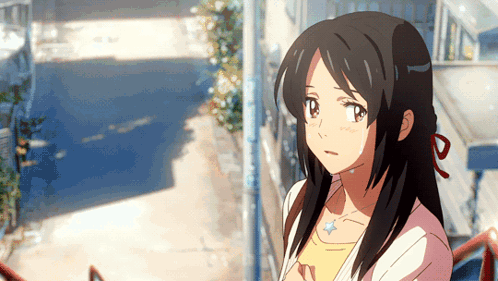 A Girl With Long Black Hair Is Wearing A Yellow Shirt GIF