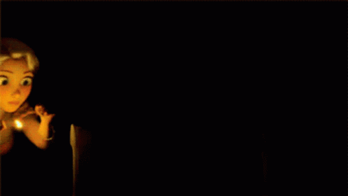 a girl with long blonde hair is surrounded by candles