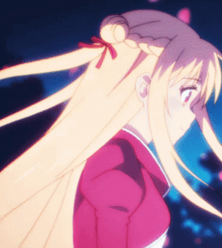 A Girl With Long Blonde Hair Is Wearing A Pink Shirt GIF