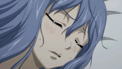 A Girl With Long Blue Hair Is Laying Down With Her Eyes Closed GIF