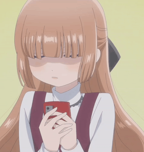 A Girl With Long Brown Hair Is Holding A Cell Phone And Making A Face GIF