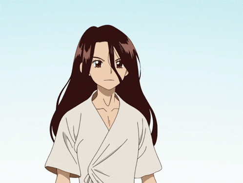 A Girl With Long Brown Hair Is Wearing A White Shirt And Has A Serious Look On Her Face GIF