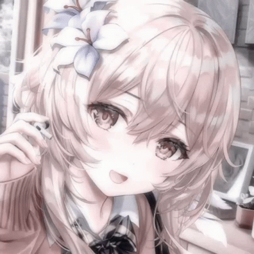 A Girl With Long Hair And A Flower In Her Hair Is Smiling . GIF