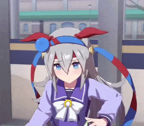 a girl with long hair and blue eyes is standing in front of a building in a video game .