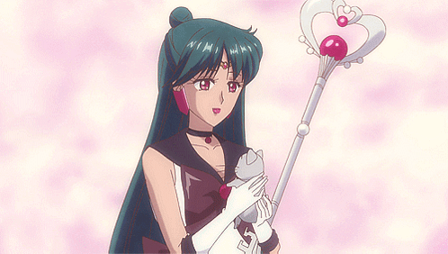 A Girl With Long Hair Is Holding A Cat And A Wand With A Heart On It GIF