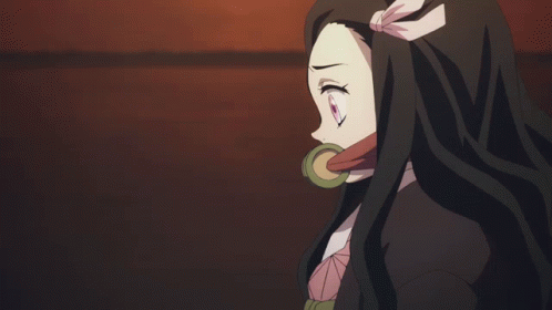 A Girl With Long Hair Is Holding A Rope In Her Mouth GIF
