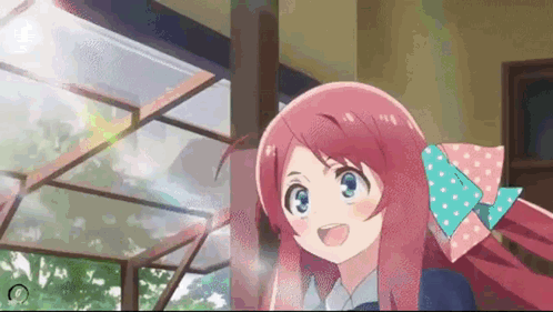 A Girl With Long Pink Hair And A Bow In Her Hair Is Smiling . GIF