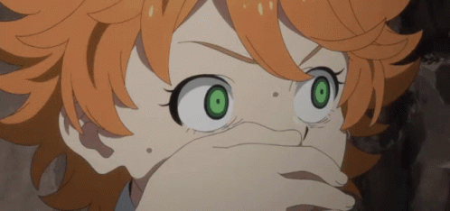A Girl With Orange Hair And Green Eyes Is Covering Her Mouth GIF