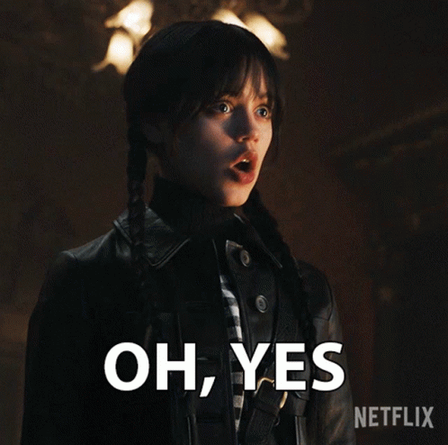 a girl with pigtails and a black jacket says " oh yes "