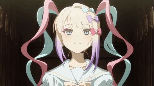 A Girl With Pigtails And A Bow In Her Hair Looks At The Camera GIF