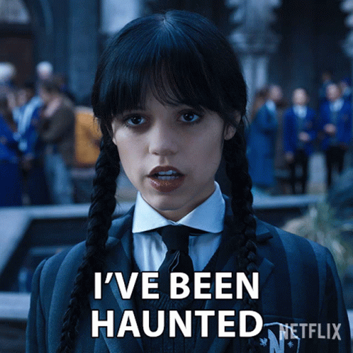 A Girl With Pigtails And A Suit Says I 'Ve Been Haunted GIF