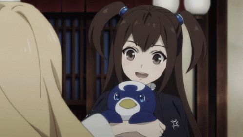 A Girl With Pigtails Is Holding A Stuffed Penguin With The Letter C On It GIF