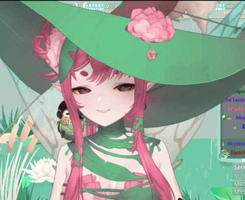 A Girl With Pink Hair And A Green Hat Is Smiling GIF