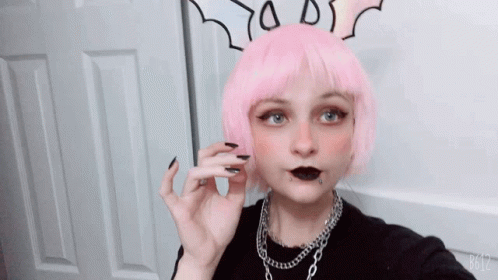 A Girl With Pink Hair And Black Nails Is Taking A Picture With B612 GIF