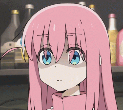 A Girl With Pink Hair And Blue Eyes Is Standing In Front Of A Shelf Full Of Bottles GIF