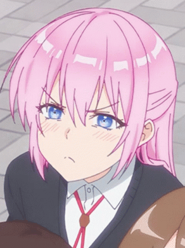 A Girl With Pink Hair And Blue Eyes Making A Funny Face GIF