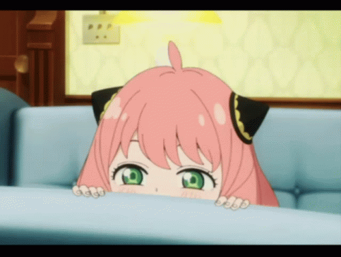 A Girl With Pink Hair And Green Eyes Looks Over A Couch GIF