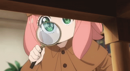 A Girl With Pink Hair And Green Eyes Looks Through A Magnifying Glass GIF