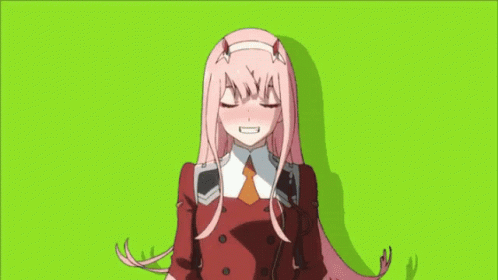 A Girl With Pink Hair And Horns Is Laying Down With Her Eyes Closed . GIF