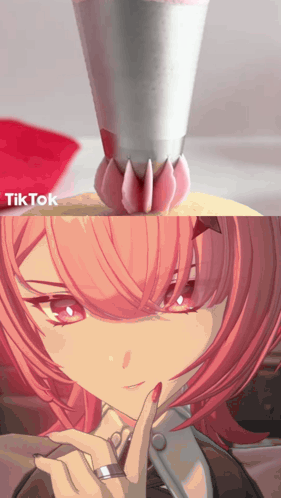 A Girl With Pink Hair Has A Ring On Her Finger And Is Being Decorated With Icing GIF