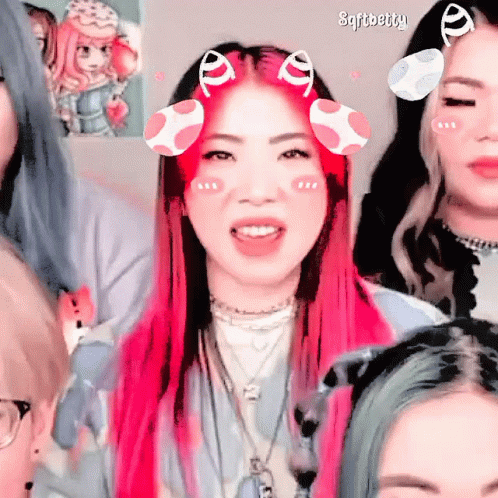 A Girl With Pink Hair Has A Sticker On Her Face That Says ' Sfitbetty ' GIF
