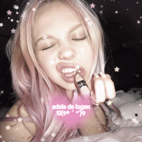 a girl with pink hair has the name adela de logan on the bottom right