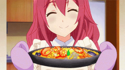 A Girl With Pink Hair Is Holding A Pan Of Food And Smiling . GIF