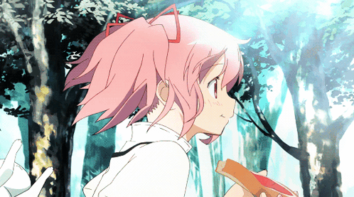 A Girl With Pink Hair Is Holding A Piece Of Bread GIF
