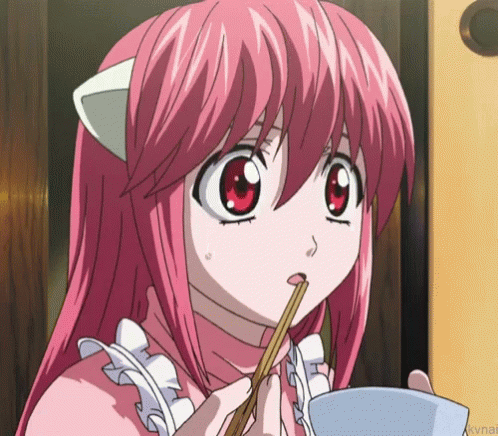 A Girl With Pink Hair Is Holding Chopsticks In Her Mouth GIF