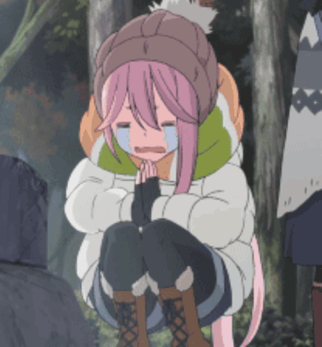 A Girl With Pink Hair Is Kneeling Down And Crying With Her Eyes Closed GIF