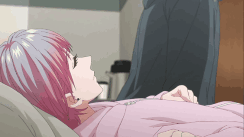 A Girl With Pink Hair Is Laying Down In A Bed GIF