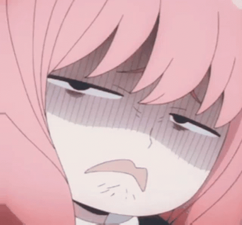 A Girl With Pink Hair Is Making A Funny Face . GIF