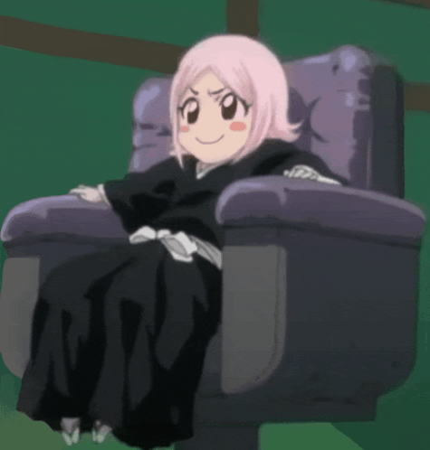 A Girl With Pink Hair Is Sitting In A Purple Chair GIF
