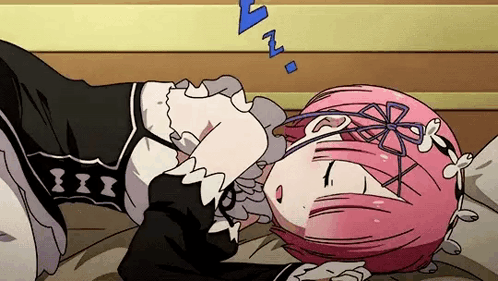 A Girl With Pink Hair Is Sleeping On A Bed With Her Head On A Pillow . GIF