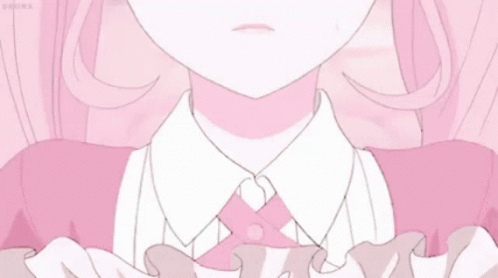 A Girl With Pink Hair Is Wearing A Pink Dress And A White Shirt . GIF
