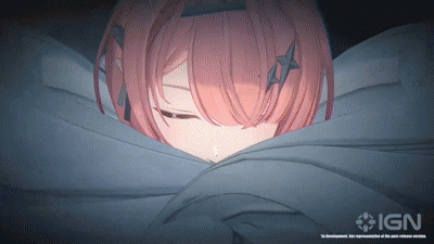 A Girl With Pink Hair Is Wrapped In A Blanket With Ign On The Bottom Right GIF