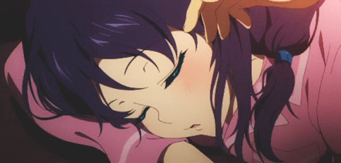 A Girl With Purple Hair Is Laying On A Pink Blanket With Her Eyes Closed GIF