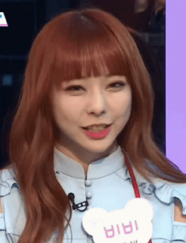 A Girl With Red Hair And A Name Tag That Says ' Iria ' GIF