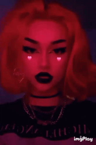 A Girl With Red Hair And Black Lipstick Is Wearing A Choker . GIF