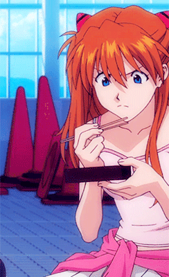 Girl With Red Hair And Blue Eyes Eating With Chopsticks GIF