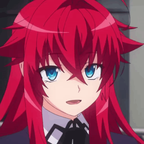 A Girl With Red Hair And Blue Eyes Is Wearing A Bow Tie GIF