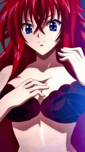 A Girl With Red Hair And Blue Eyes Is Wearing A Bra GIF