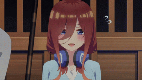 A Girl With Red Hair And Blue Eyes Is Wearing Headphones And Making A Surprised Face GIF