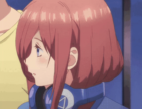 A Girl With Red Hair And Blue Eyes Is Wearing Headphones With The Letter A On It GIF