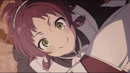 A Girl With Red Hair And Green Eyes Laying Down GIF