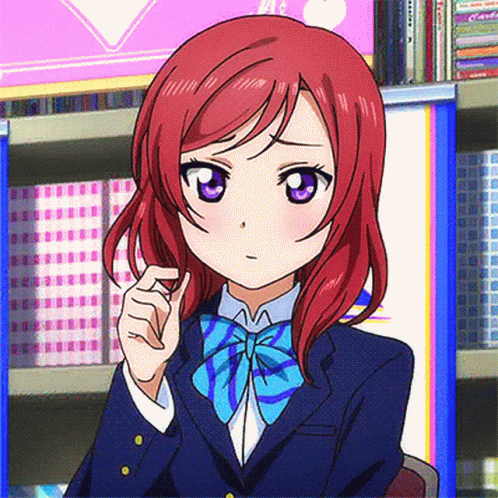 A Girl With Red Hair And Purple Eyes Is Wearing A Bow Tie GIF