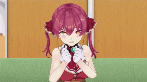 A Girl With Red Hair And White Gloves Is Sitting On A Green Carpet GIF