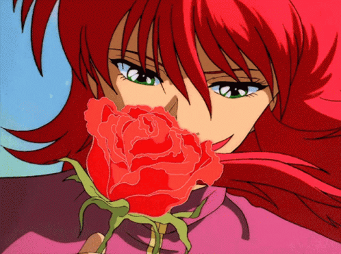 A Girl With Red Hair Is Holding A Red Rose In Her Hand GIF