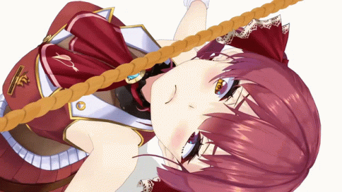 A Girl With Red Hair Is Laying On Her Back GIF