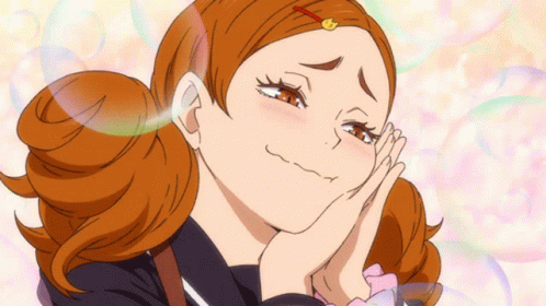 A Girl With Red Hair Is Making A Funny Face With Her Hands On Her Face GIF